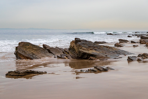 A large rock on the rocky beaches of Crystal Cove in Newport Beach, California