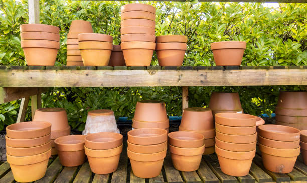 istock Stacks of various terracotta pots for plants 1456640189