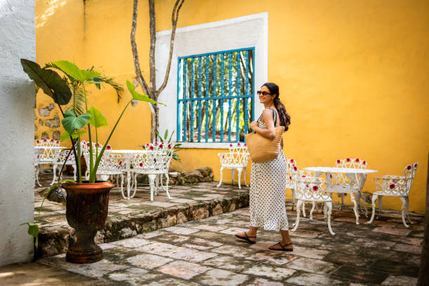 Woman walking down the streets of Mexican city Valladolid