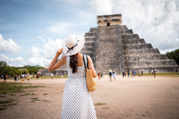 istock Tourist visiting Chichen Itza pyramid in Mexico 1456642444