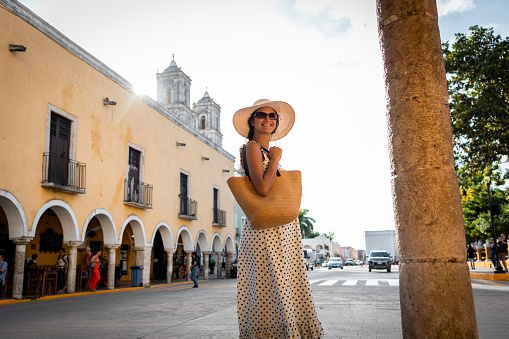 Woman walking down the streets of Mexican city Valladolid