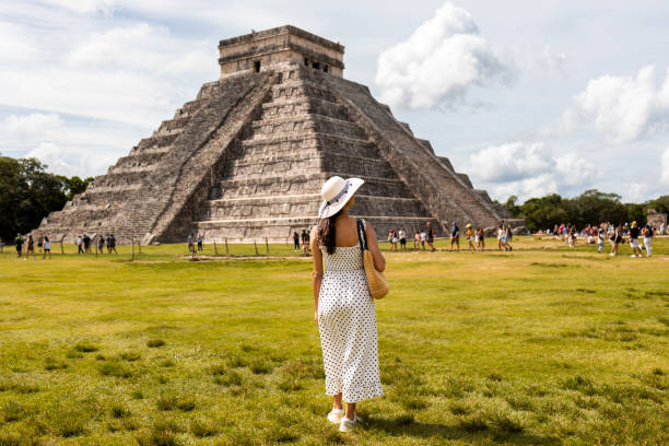 istock Tourist visiting Chichen Itza pyramid in Mexico 1456642591