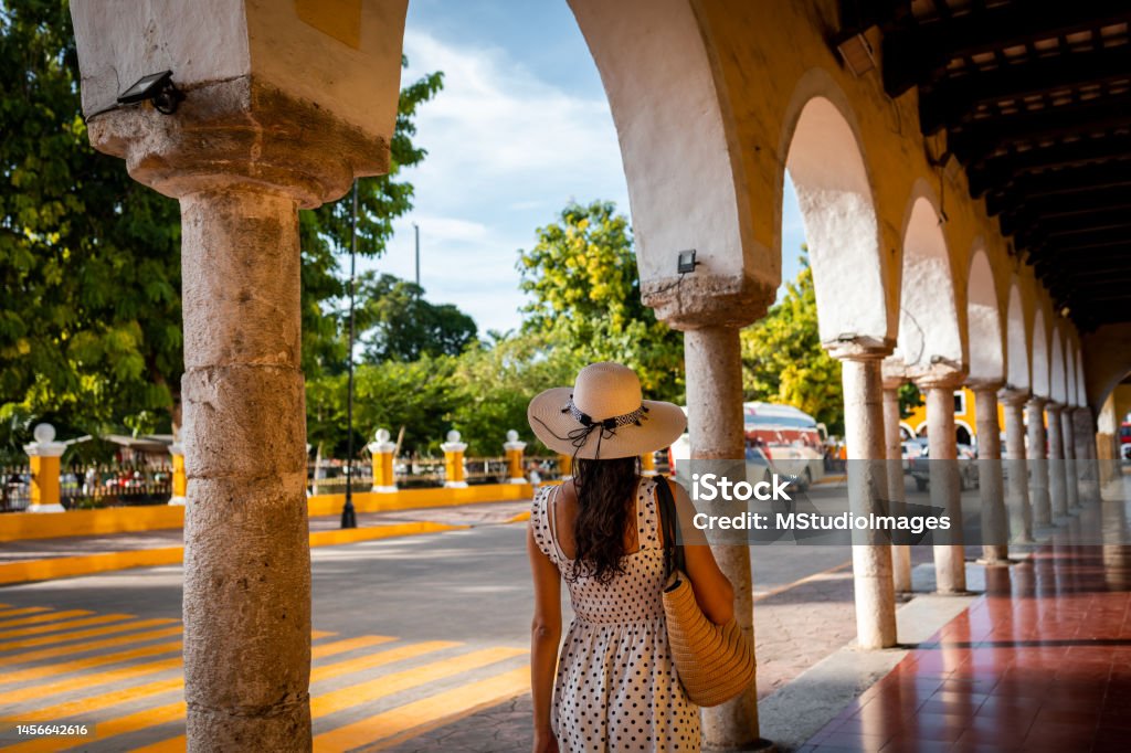 Latin woman visiting Mexico Woman walking down the streets of Mexican city Valladolid Mexico Stock Photo