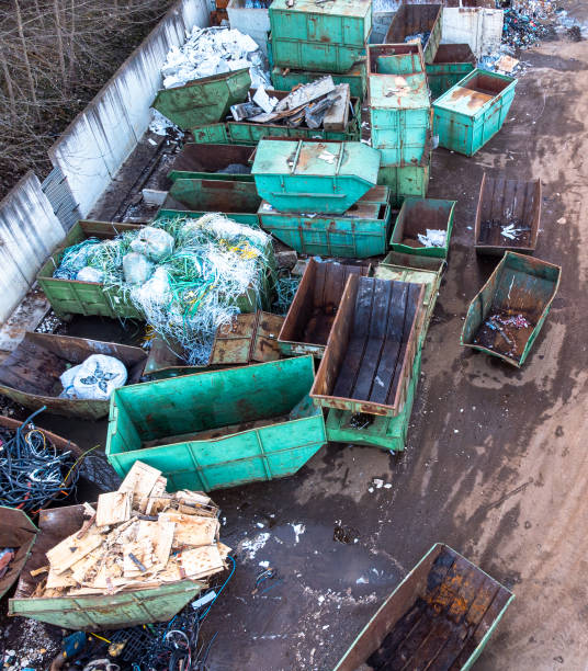 istock Recycling center with different garbage types and empty containers aerial view 1456646837