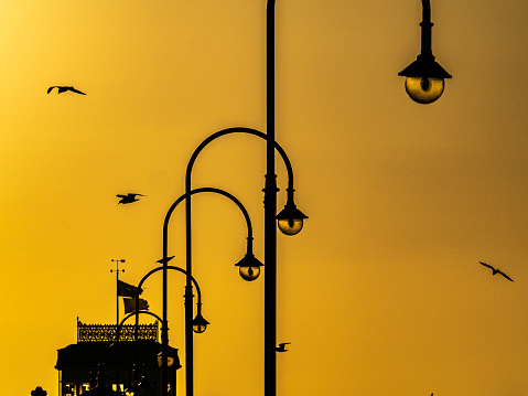 The lights on St Kilda pier in silhouette
