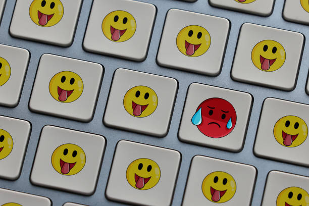 istock Emoticon faces concept. Standing out from the crowd 1456652523
