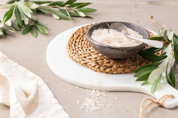istock Organic raw long grain rice - Basic cereal for food. Healthy food ingredients on kitchen countertop 1456653669