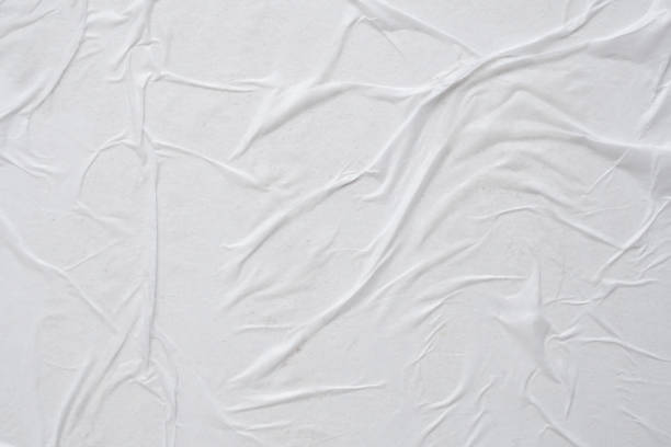 istock white crumpled and creased paper poster texture background 1456659350