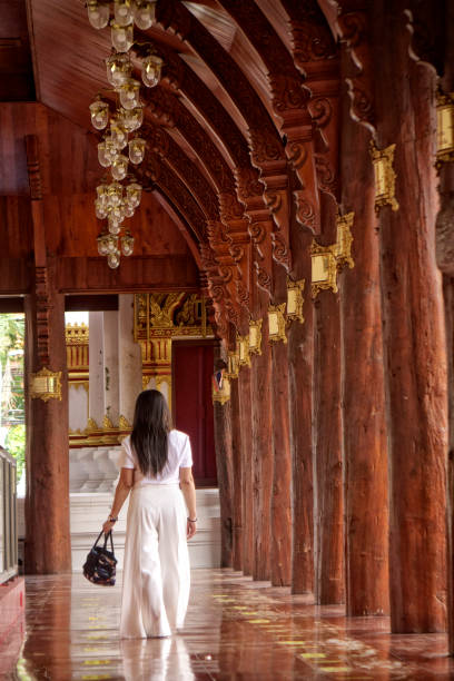 istock Young Asian woman in ancient Buddhist temple 1456679268
