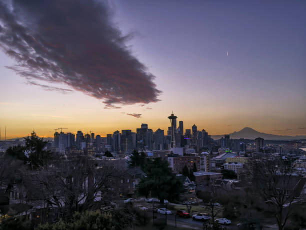 Seattle city skyline with Mt Rainier at sunset with urban office buildings viewed from Kerry Park.