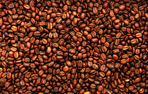 Coffee beans, food background and texture from freshly roasted arabica coffee beans, top view