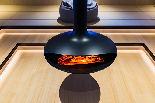 A hanging heater placed in the center of the room