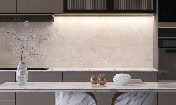 istock Luxury, elegant marble dining table and brown kitchen counter with white countertop, cabinet, cupboard and beige granite splashback 1456696684