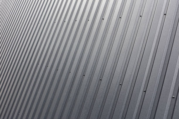 istock dark corrugated metal wall with bolts. industrial textured surface. 1456697081