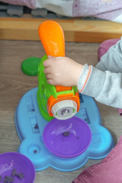 istock unrecognizable child playing with a plasticine toy 1456700893