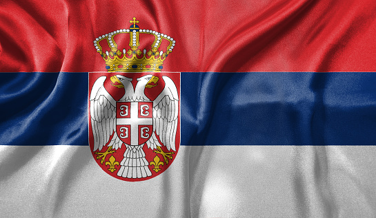 Serbia flag wave close up. Full page Serbia flying flag. Highly detailed realistic 3D rendering.