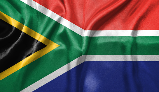 South Africa flag wave close up. Full page South Africa flying flag. Highly detailed realistic 3D rendering.