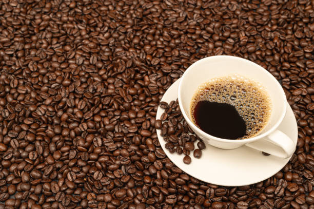 istock Cup of coffee on brown coffee beans 1456705254
