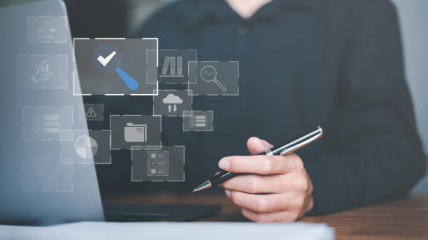 istock Businessman Audit online documents, quality assessment management With a checklist, business document evaluation process, market data report analysis and consulting, plan review process. 1456714715