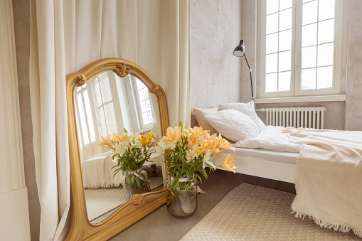 High angle view of a comfortable bed in a luxury hotel suite. Interior of a luxurious hotel room, computer generated image.