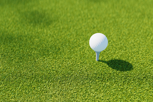 golf ball on tee on grass field, 3d rendering