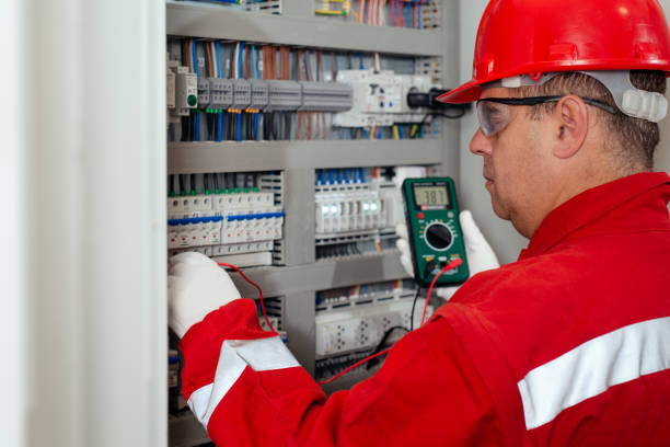 istock Electricity and electrical maintenance service, Engineer hand holding AC voltmeter checking electric current voltage. 1456719135