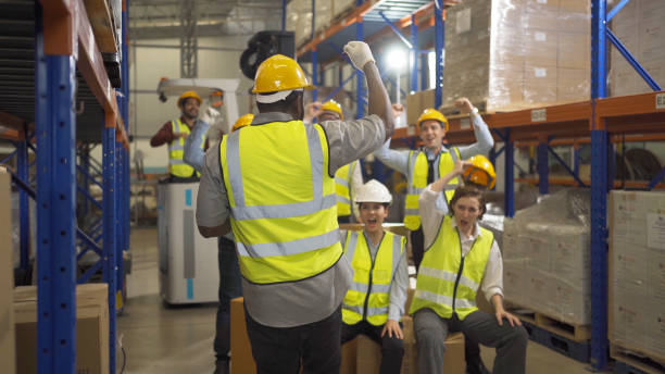 istock Teamwork group of multi ethnic workers working in large warehouse retail store industry factory. Stock storage. Cargo in ecommerce and logistic concept. Depot. People lifestyle. Shipment service. 1456720385