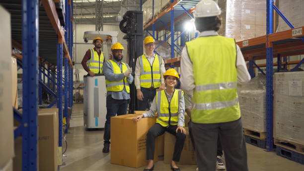 istock Teamwork group of multi ethnic workers working in large warehouse retail store industry factory. Stock storage. Cargo in ecommerce and logistic concept. Depot. People lifestyle. Shipment service. 1456720402
