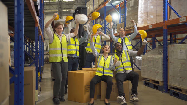 istock Teamwork group of multi ethnic workers working in large warehouse retail store industry factory. Stock storage. Cargo in ecommerce and logistic concept. Depot. People lifestyle. Shipment service. 1456720404