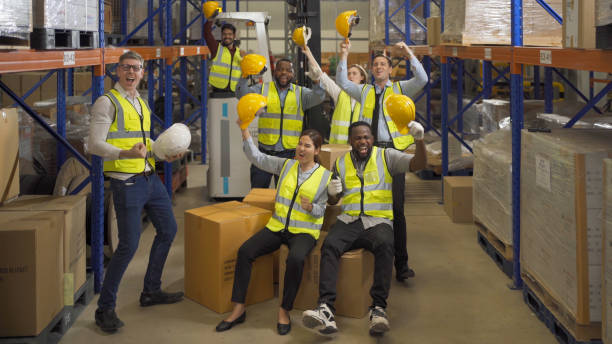 istock Teamwork group of multi ethnic workers working in large warehouse retail store industry factory. Stock storage. Cargo in ecommerce and logistic concept. Depot. People lifestyle. Shipment service. 1456720425