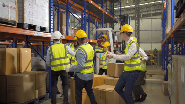 istock Teamwork group of multi ethnic workers working in large warehouse retail store industry factory. Stock storage. Cargo in ecommerce and logistic concept. Depot. People lifestyle. Shipment service. 1456720433