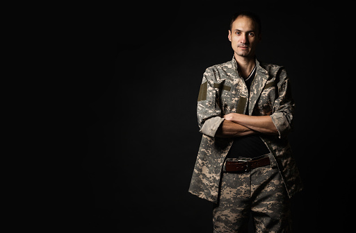 Serious Army Soldier on black background