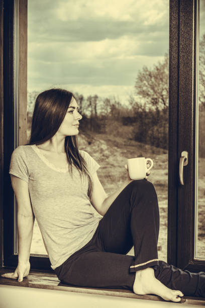 istock Beautiful woman drinking morning coffee. 1456723947
