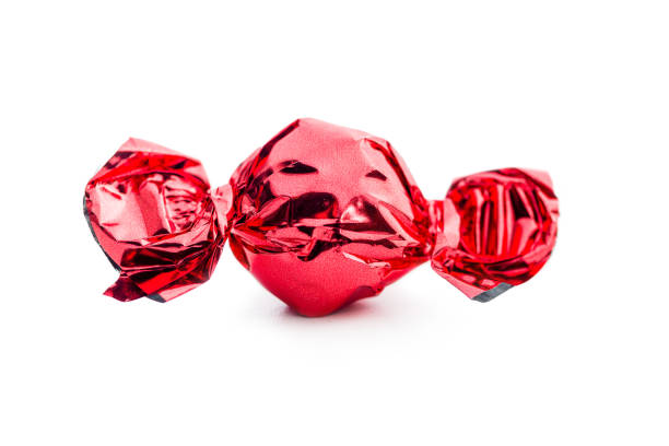 High Angle View Of Multi Colored Chocolates Against White Background