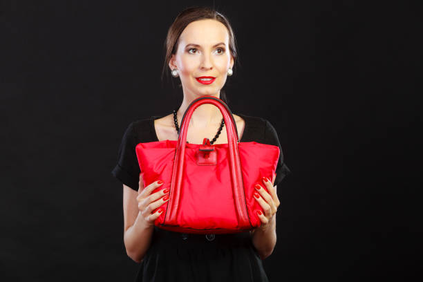 Pink purse on pastel colour background