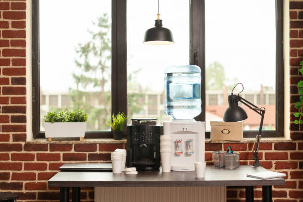 close up of water dispenser and coffee machine on table in meeting office - 2586 imagens e fotografias de stock
