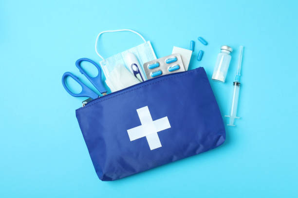 istock First aid medical kit on blue background 1456731821