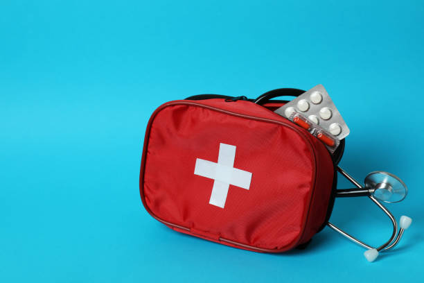 istock First aid medical kit on blue background 1456731851