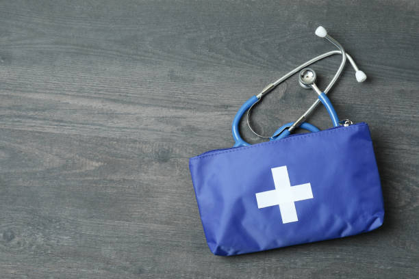 istock First aid medical kit on dark wooden background 1456732277