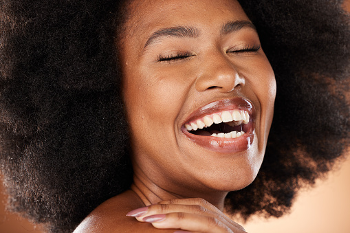 Black woman, happy portrait and closeup beauty with smile, skincare and wellness with natural african hair. Model, woman and afro with makeup, skin and studio happiness for self care cosmetics girl