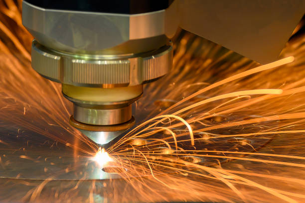 Close-up scene the fiber laser cutting machine cutting  machine cut the metal plate. stock photo
