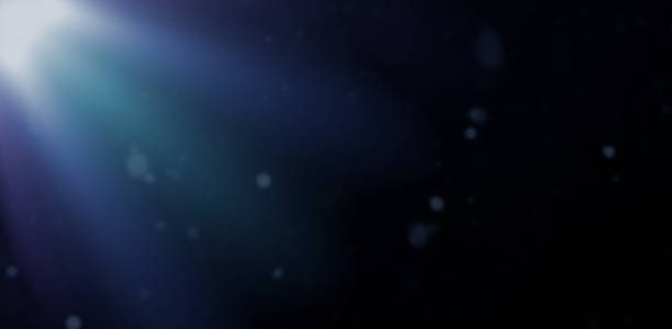 istock Abstract sparkling light rays and lighting flare bokeh against on dark background 1456735170