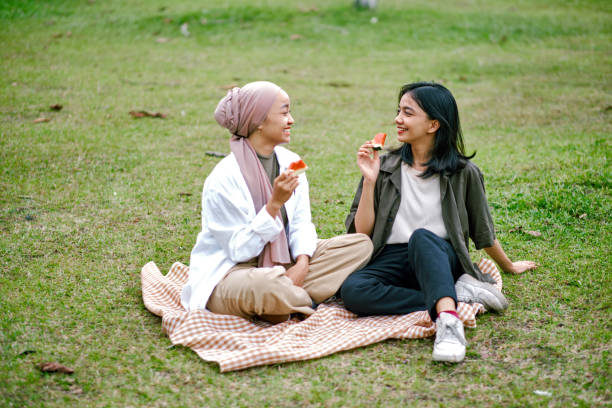 istock Happy sisters spending weekend together  at the park. 1456736930