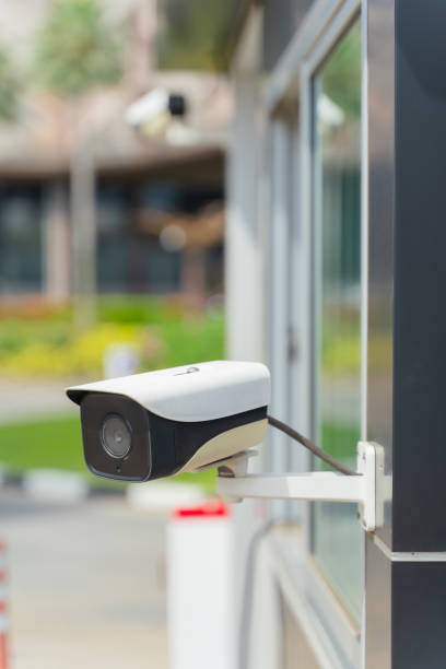 istock Outdoor CCTV camera, circuit camera security system on the wall building. 1456737416