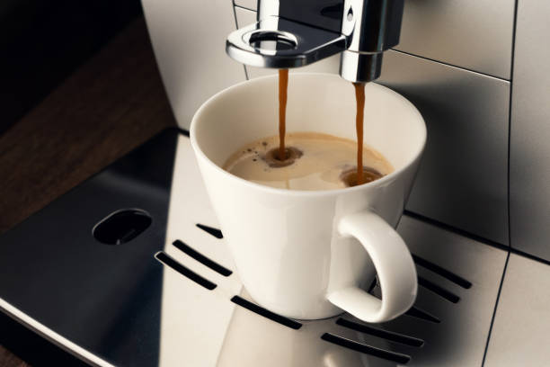 istock preparing a cup of coffee in a coffee machine 1456739908