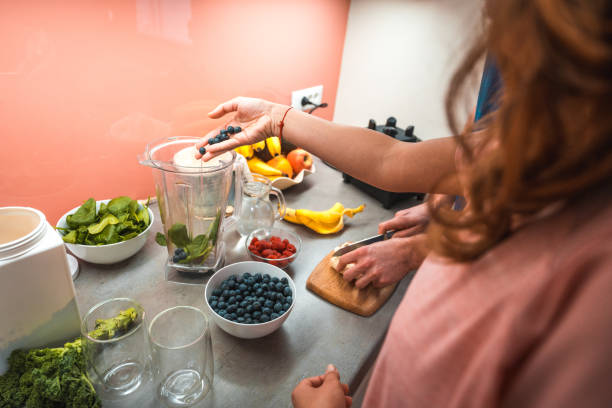 istock Attractive Mixed Race Couple Preapring A Post Workout Smoothie 1456741175