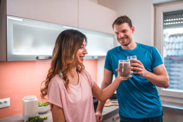 istock Cheerful Multi-Ethnic Couple Drinking A Smoothie After Exercising Together 1456741222