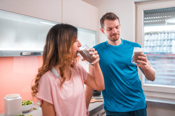 istock Cheerful Multi-Ethnic Couple Drinking A Smoothie After Exercising Together 1456741230