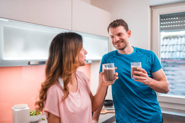 istock Cheerful Multi-Ethnic Couple Drinking A Smoothie After Exercising Together 1456741265