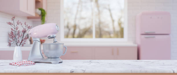 istock White marble kitchen tabletop with pastel pink stand mixer or dough mixer in pink kitchen. 1456741332